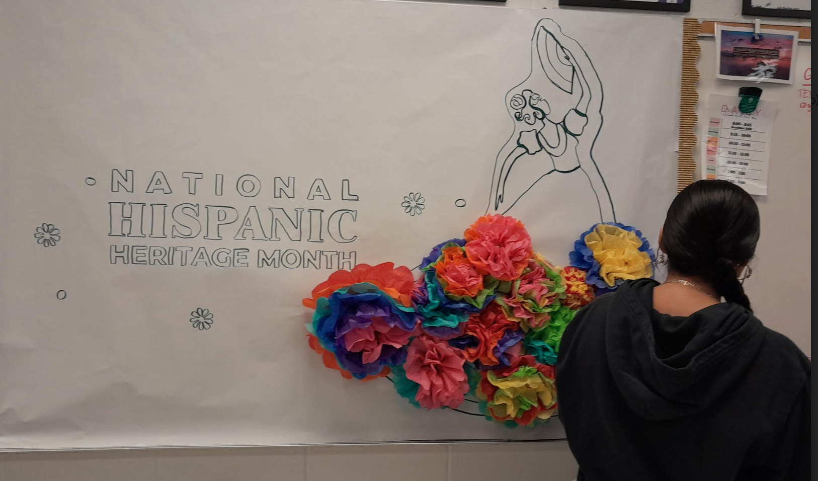 Hand-made paper flowers were attached to depict the colorful folklorico dress of the dancer.