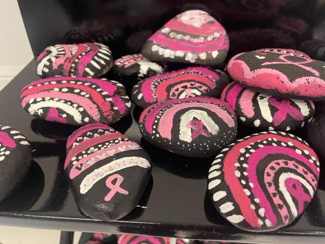 Painted encouragement and support rocks in symbolic pink will be given to breast cancer patients undergoing treatment at the Caner Center in Greenville.