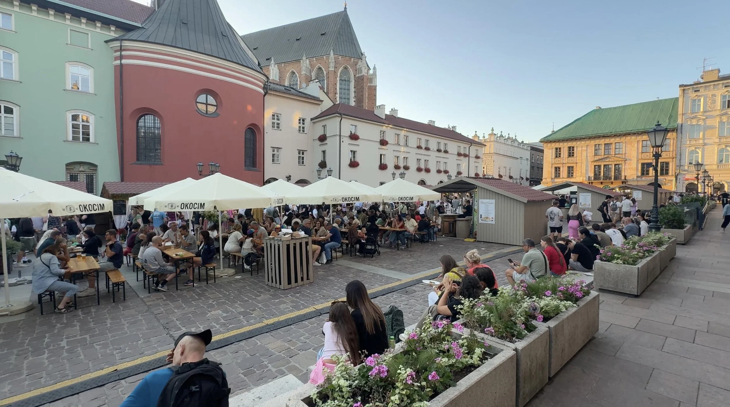Crowds eating and drinking at Kraków’s Pierogi Festival in Old Town