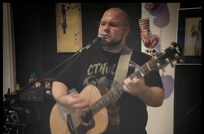 Ben Bollinger of Six Bar Break performs on the Acoustic Stage