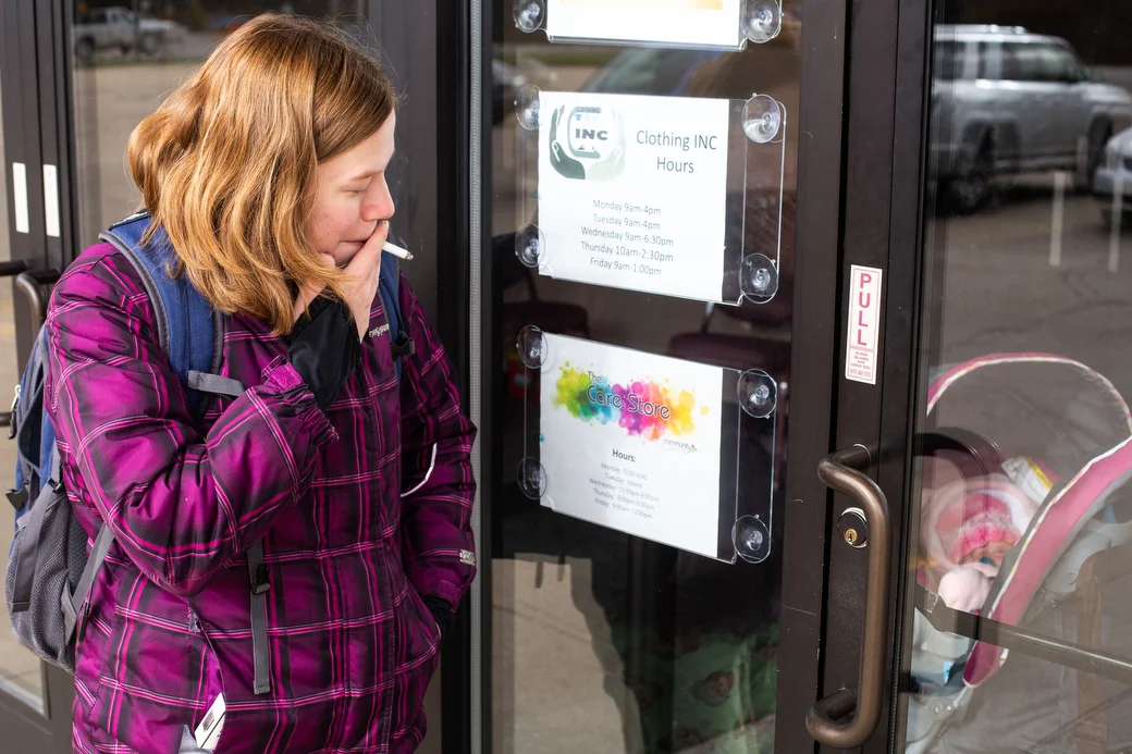  Yvonne "Ivy" Kemp stands outside to smoke and keeps an eye on her daughter, Christina Kemp, 24 days, in her stroller, Tuesday, Nov. 13, 2018 at the Isabella County Restoration House. Ivy found herself homeless just a few days after Christina’s birth