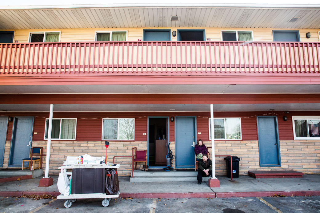  Ivy and Wayne sit outside their room at the Chippewa Motel and have a smoke, Friday, Nov. 23, 2018. Ivy met Wallace, who is not Christina's father, while in the shelter. He recently started working at a construction site and paid for their motel roo