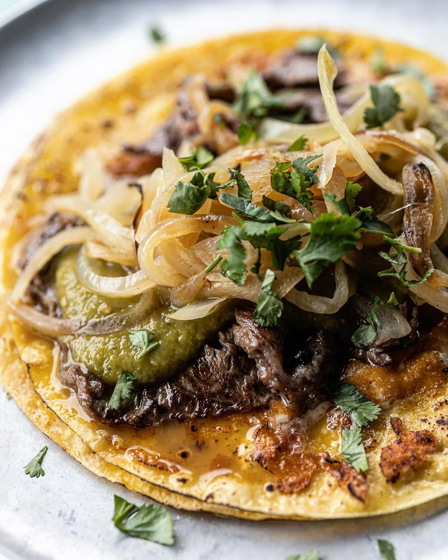 The King of the Mexican street tacos.
Flavourful and delicious; melted cheese, mexican style grilled AAA beef, avocado salsa verde, caramelized onions.

#victoriabc #vancouverisland
#asada #carneasada 
.
.
.
.
.
.
.
#cambievillage
#broadwaycityhall #