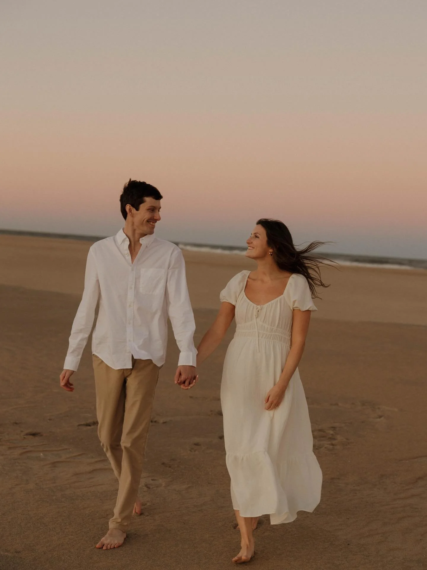 Our favorite hide-and-seek real estate agent @erinhendersonrealestate is getting married. 🥹

May this sweet photo of Erin (class of '21) and her fianc&eacute; Nathaniel warm your heart on this cold, rainy day in VB. 🤎 Congratulations, you two!