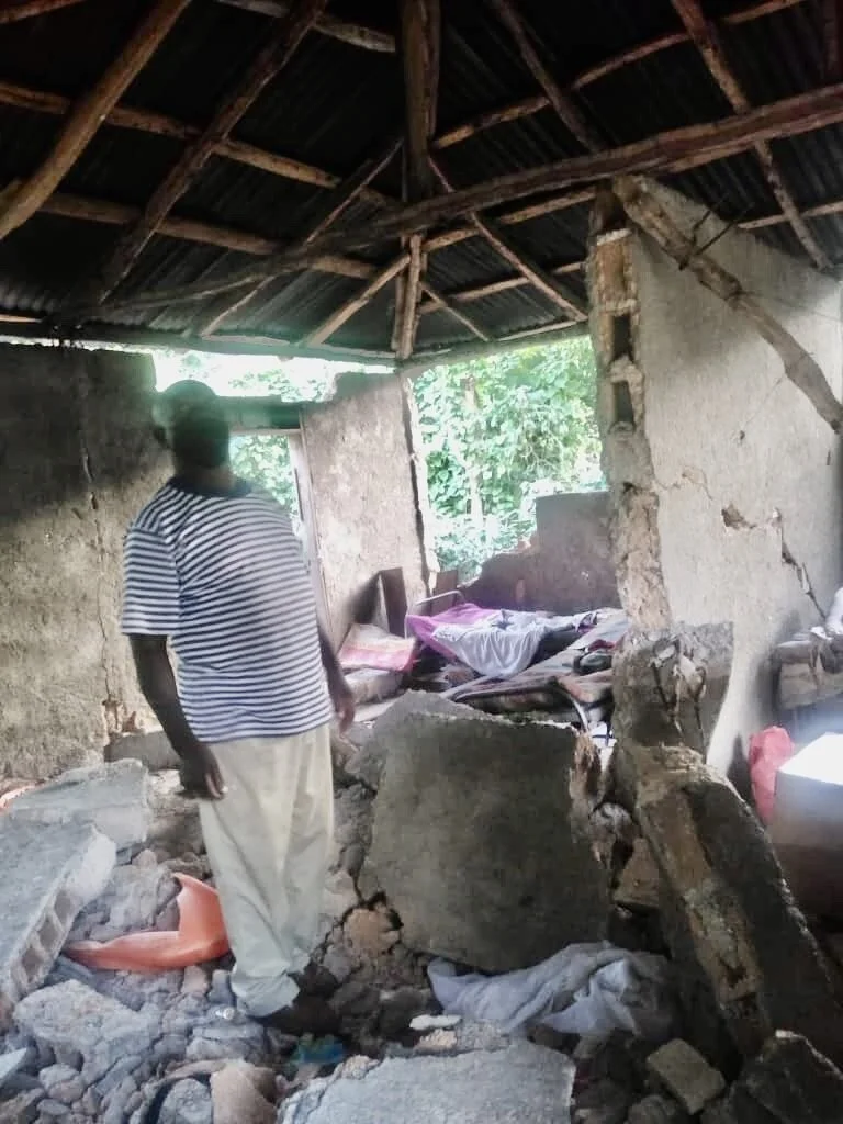 Standing in the midst of what’s left of his home is one of RHEMA Haiti’s  current students,who also serves as pastor of a local church in the area that was impacted by the 7.2 magnitude earthquake that hit Haiti on August 14.