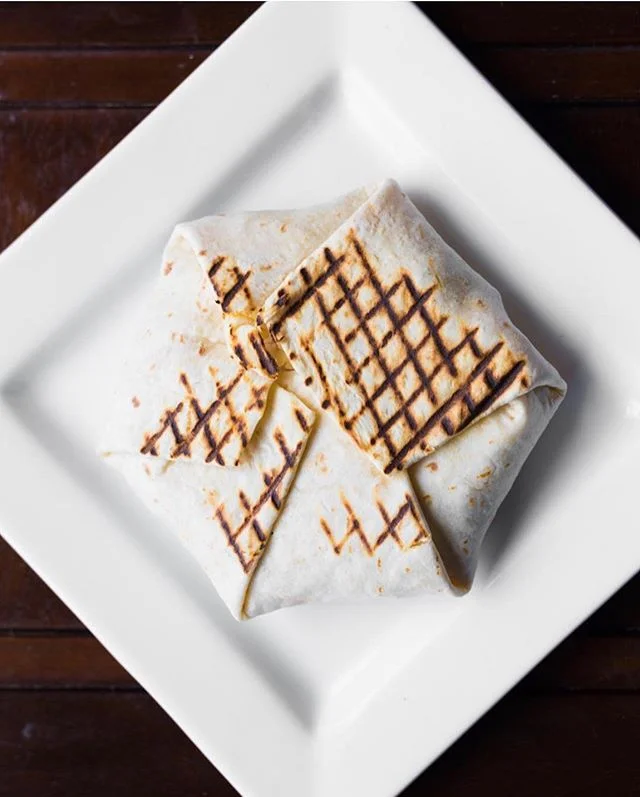 Lulu Bar is a great spot to grab a quick snack during happy hour! Their crunch wrap and cheesy torta are only 5 dollars and are guaranteed to satisfy 😌 (via @lulubarpdx) 
For full review hit the link in bio ⬆️