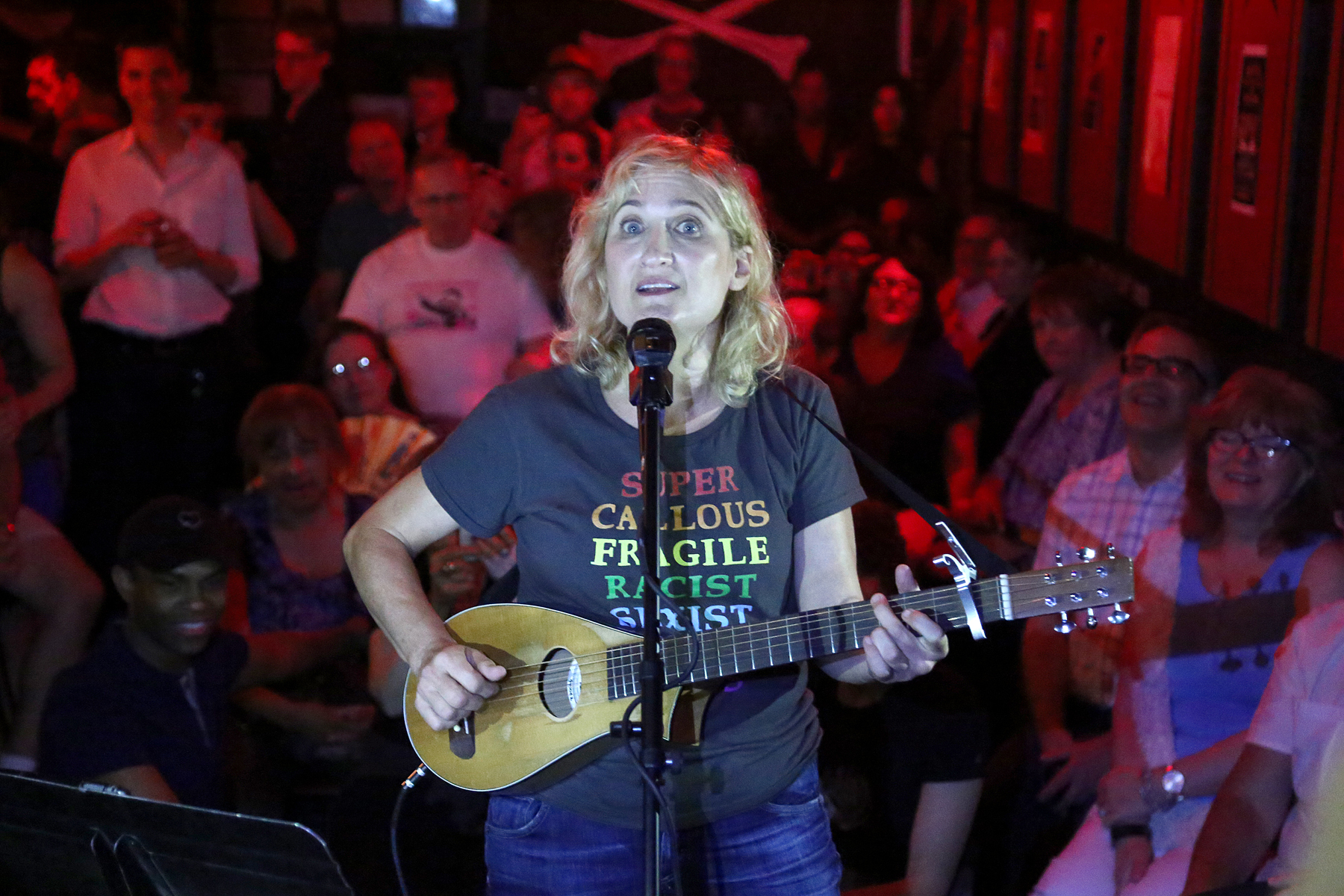  A singer thrills the crowd from the stage. 