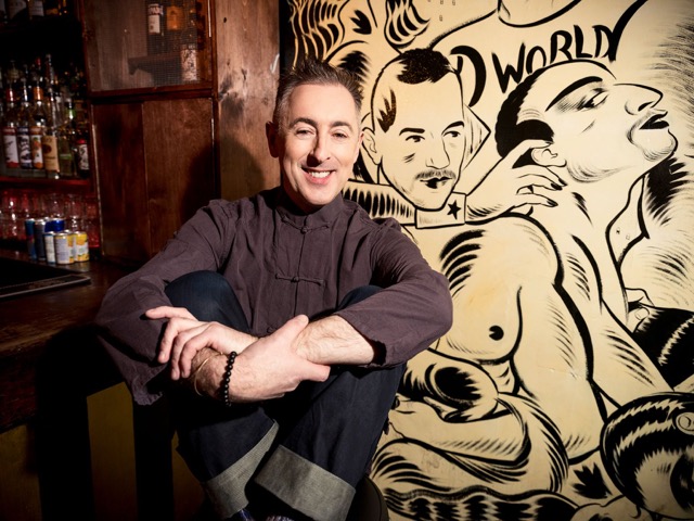  Alan Cumming, one of the owners of the bar, poses next to a ‘Cabaret Themed’ mural.  