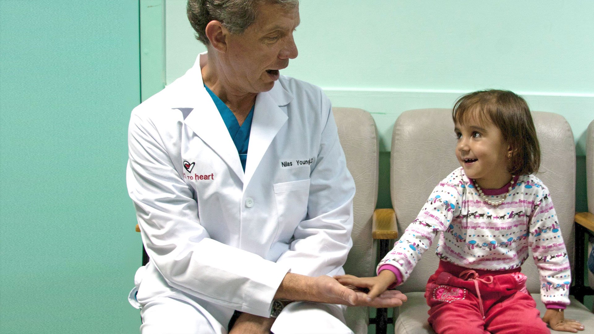  Making a playful connection with a young heart patient. 