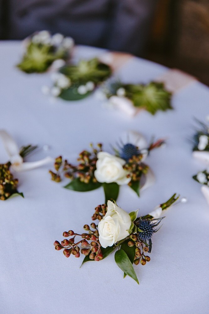 Boutonnieres_Jackpot_Thistle_White_Rose.jpg