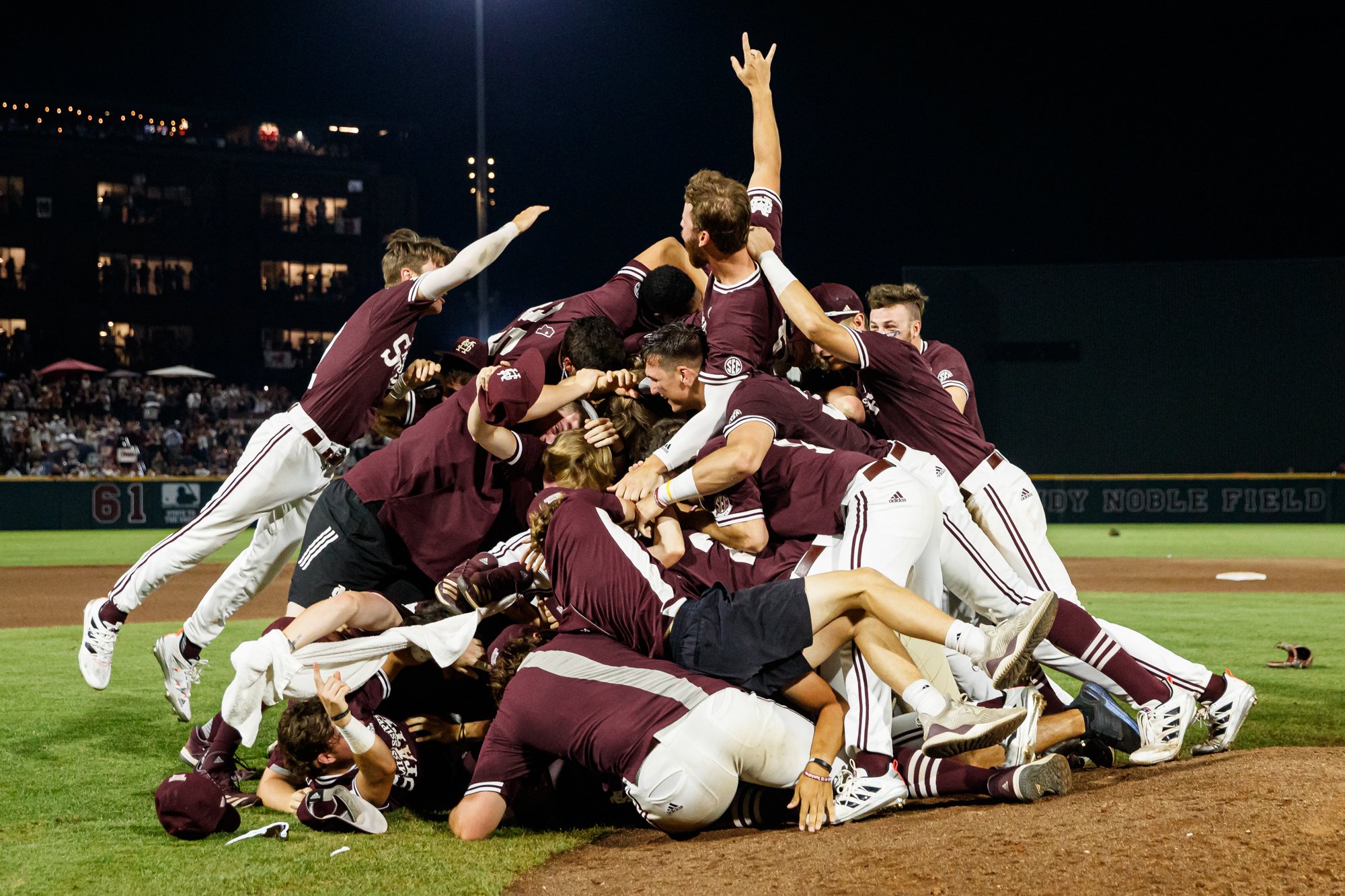 STARKVILLE, MS - June 14, 2021 - The Mississippi State Bulldogs celebrate after an NCAA Super Regional game between the Notre Dame Fighting Irish and the Mississippi State Bulldogs at Dudy Noble Field at Polk-Dement Stadium in Starkville, MS. Photo