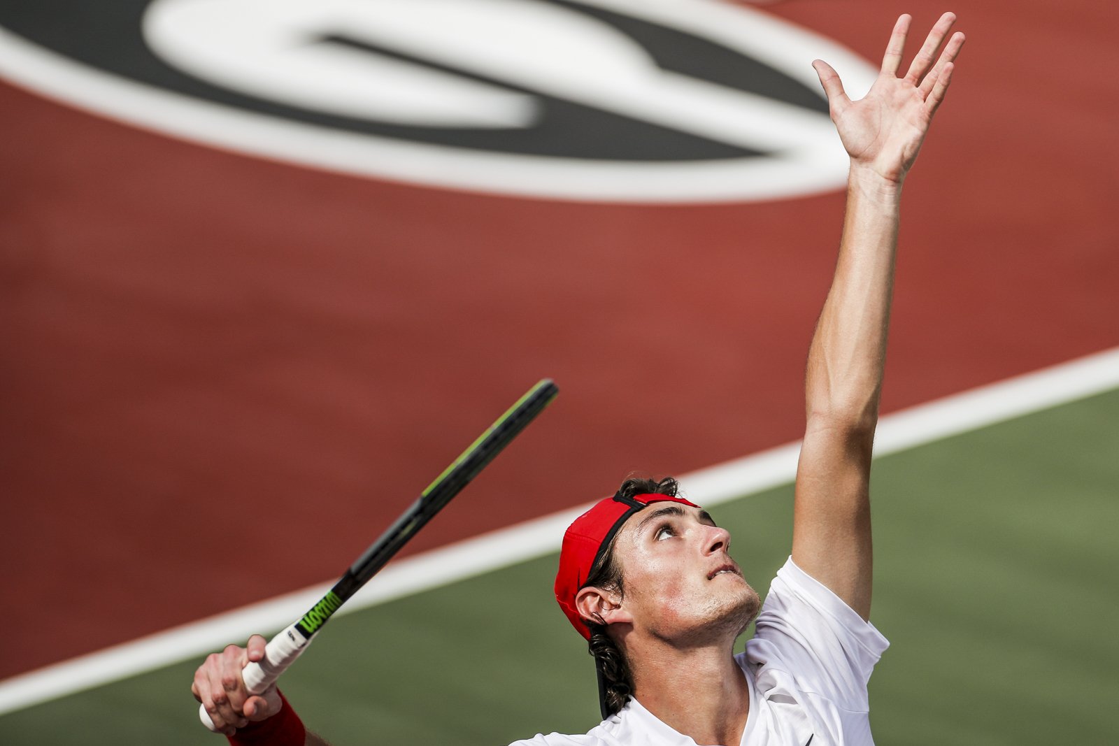 Georgia tennis player Baptiste Anselmo serves during a match against Mississippi State at the Dan Magill Tennis Complex in Athens, Ga., on Sunday, Feb. 28, 2021. (Photo by Chamberlain Smith)