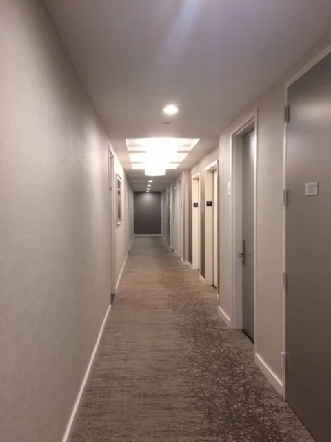 Notice how the baseboard brings a sense of structure and order to this hallway.