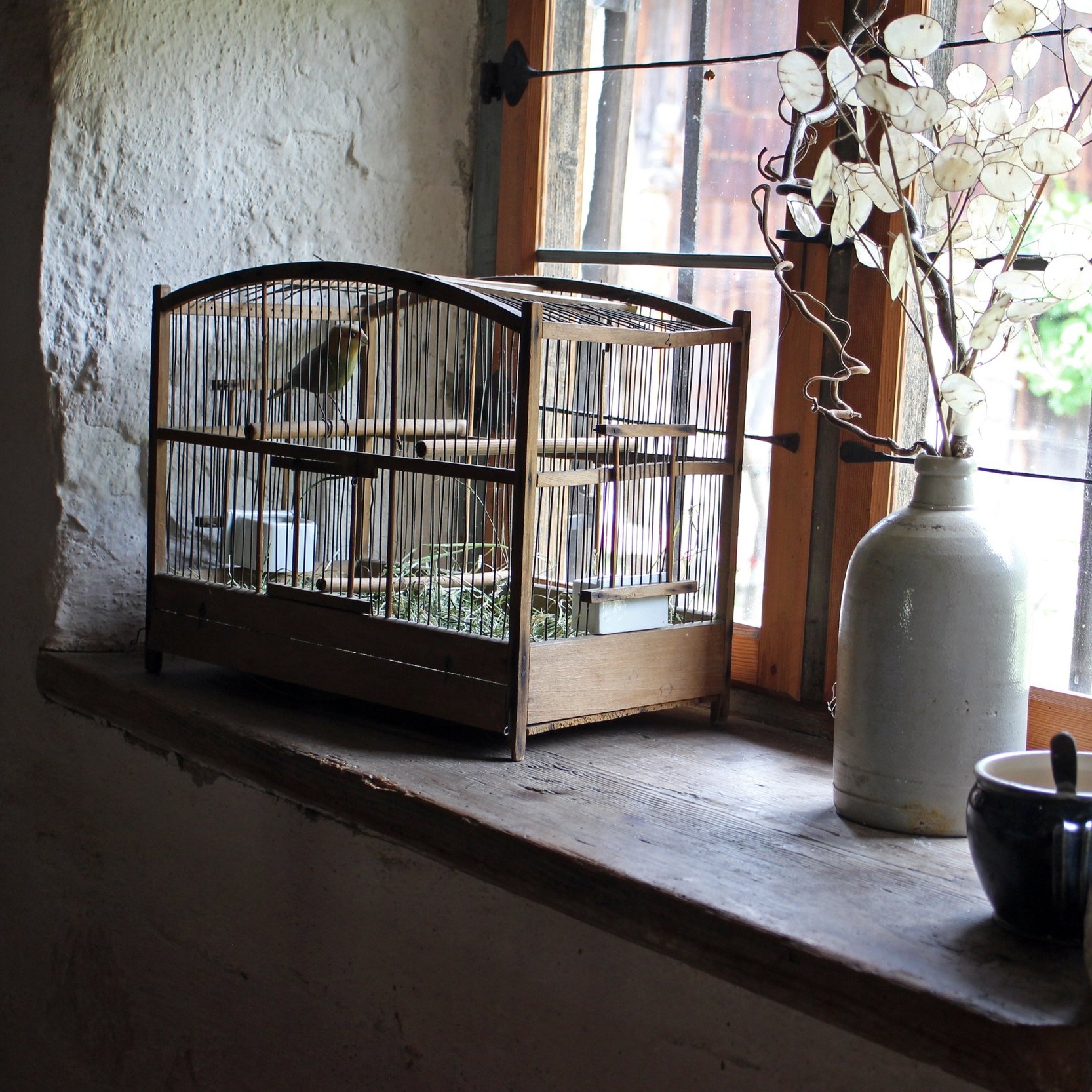 Even the presence of a sill adds charm to the rough window.