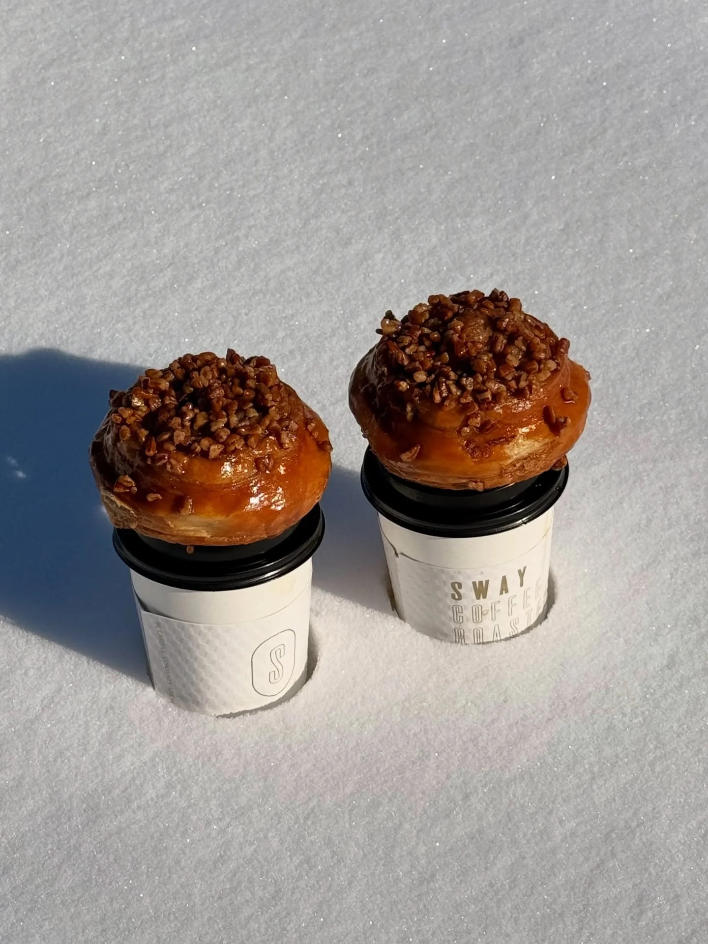 ❄️ the last patch of fresh snow in KC is behind the bakery if you guys want to come get coffee and take some cute pics btw 📸