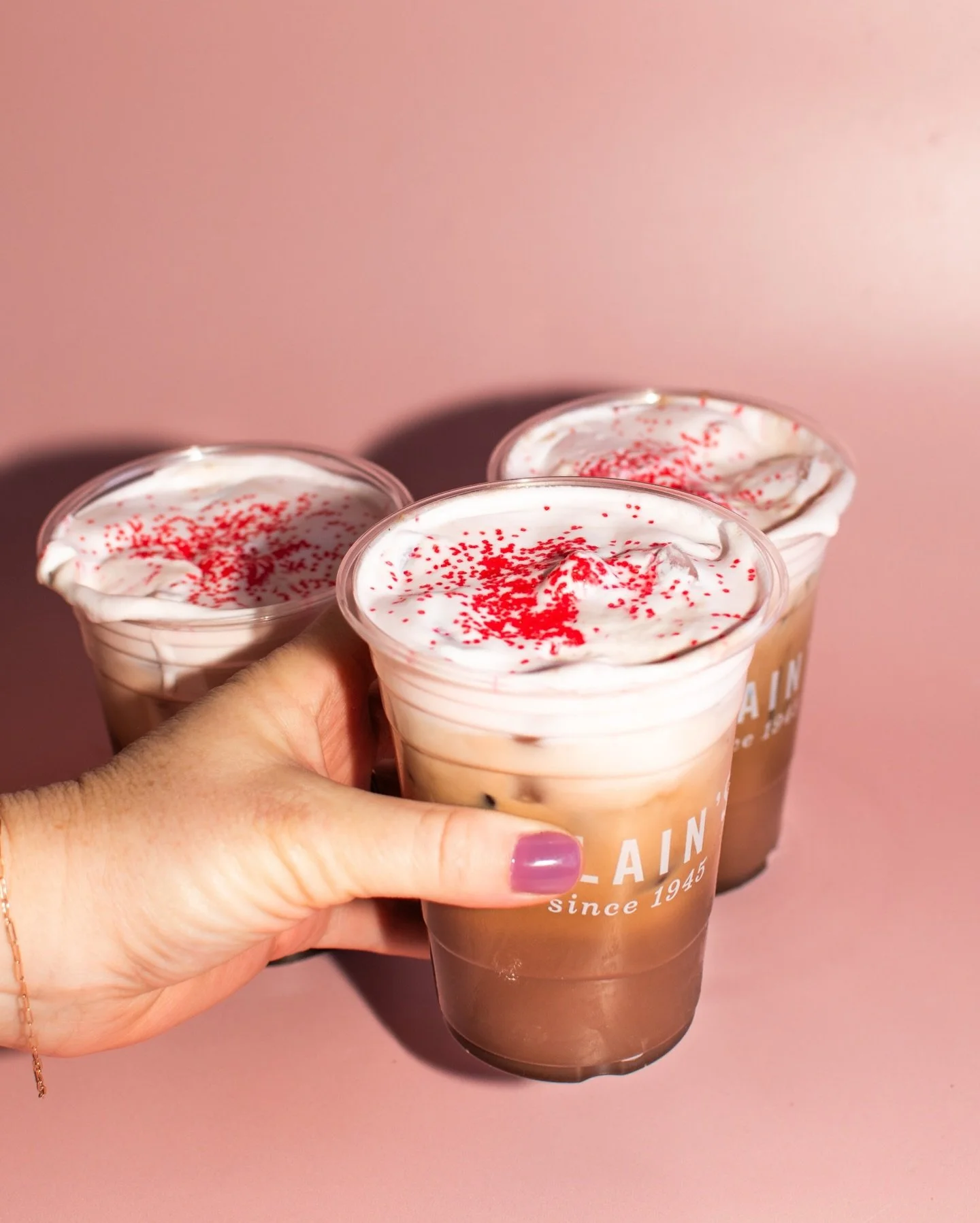 LOVER LATTE IS BACK 🍓🍫 

iced strawberry mocha topped with strawberry cold foam and sugar sprinkles ✨ 

here through february!