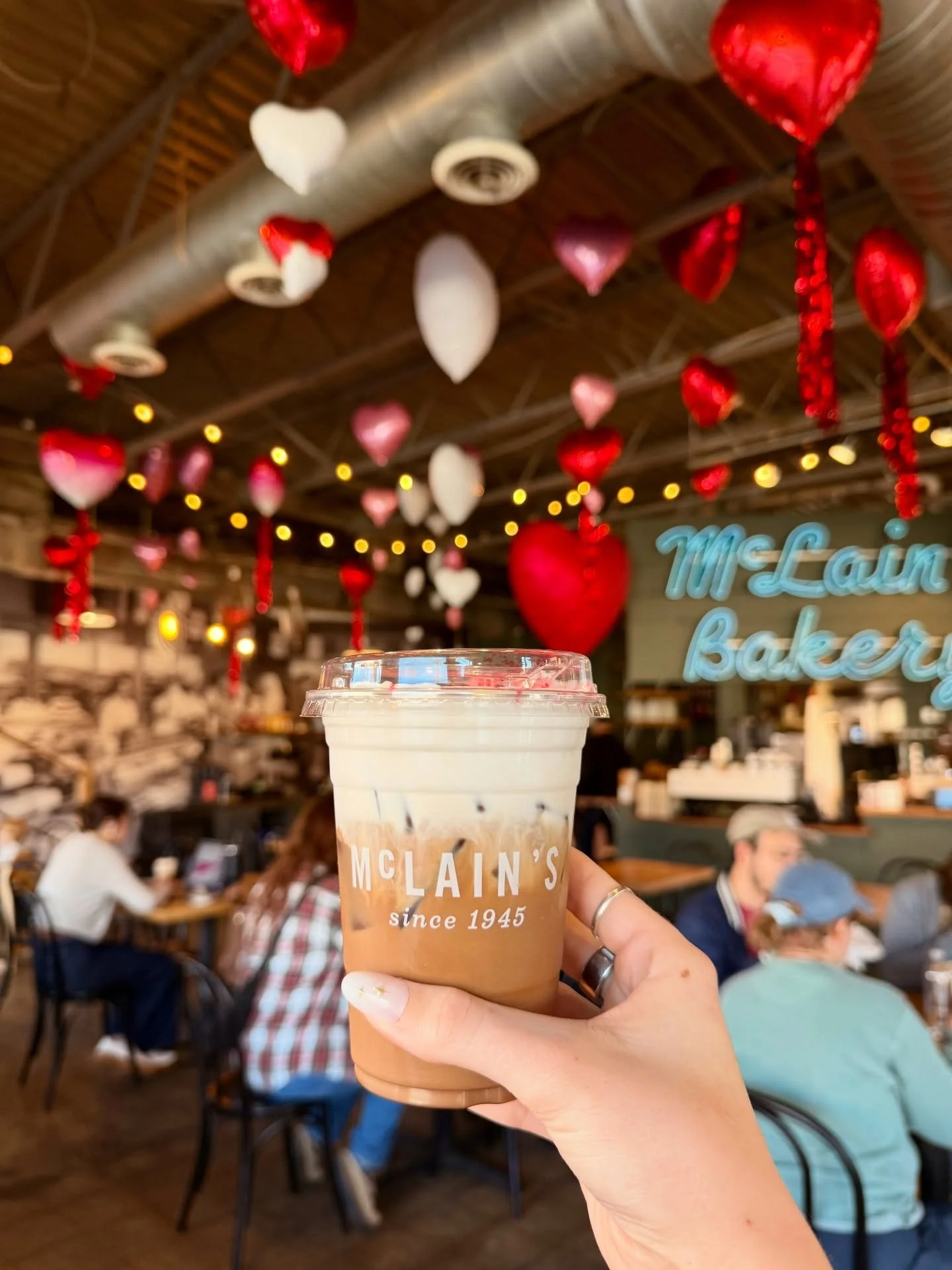 💘 In LOVE with the balloons @upupandawayballoons filled the bakery with! Stop by to see and grab a Lover Latte here through March! 💌