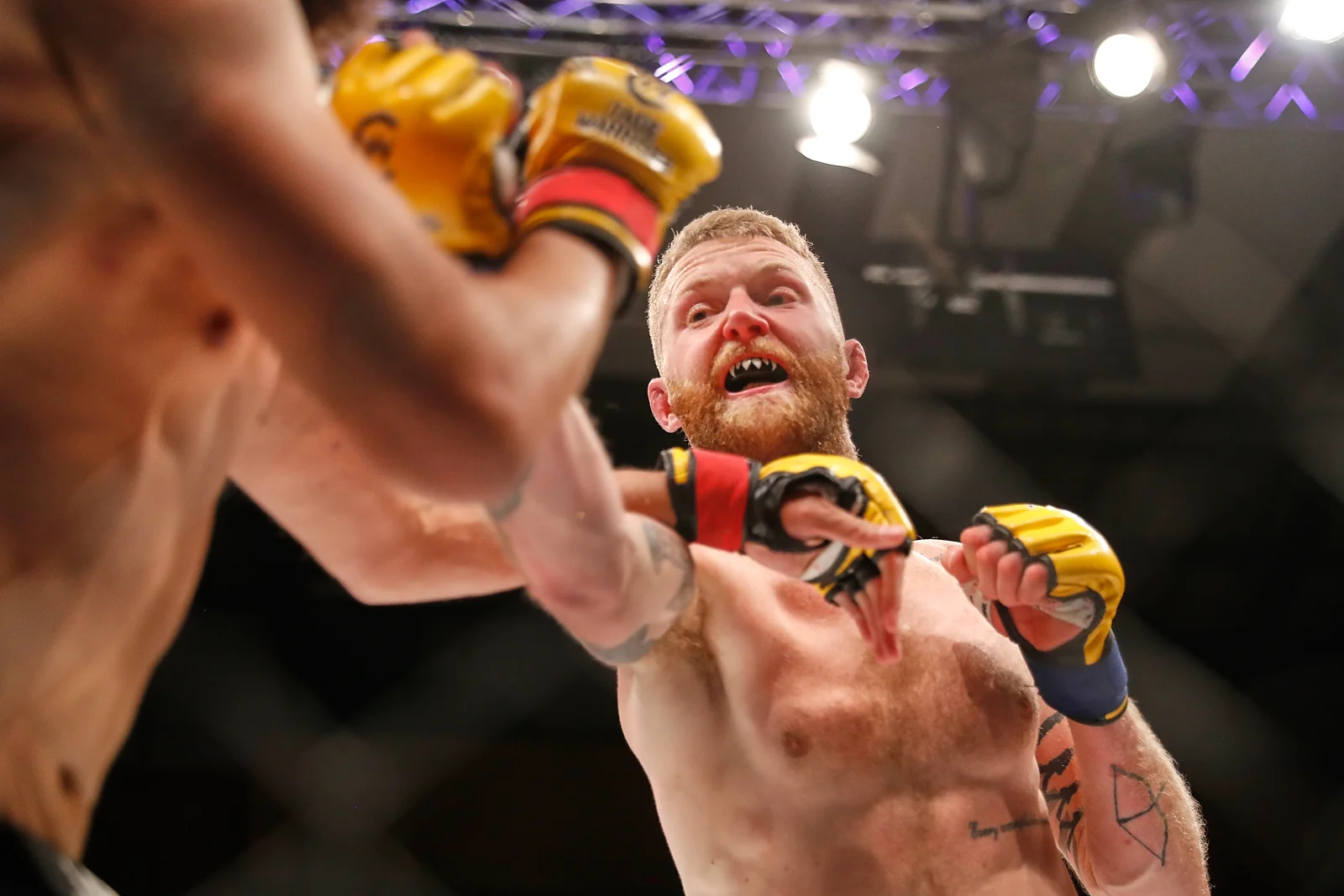 Tim Barnett launches a right hand at Sean Carter during their CW105 bout