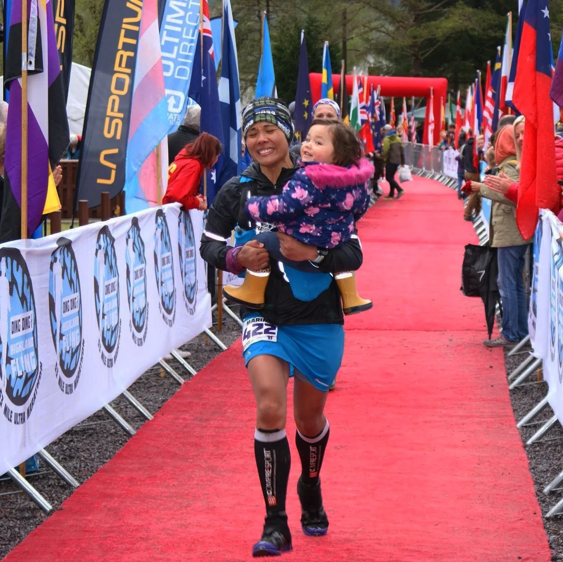 Carrying our daughter Aria along the red carpet to the Finish Line.