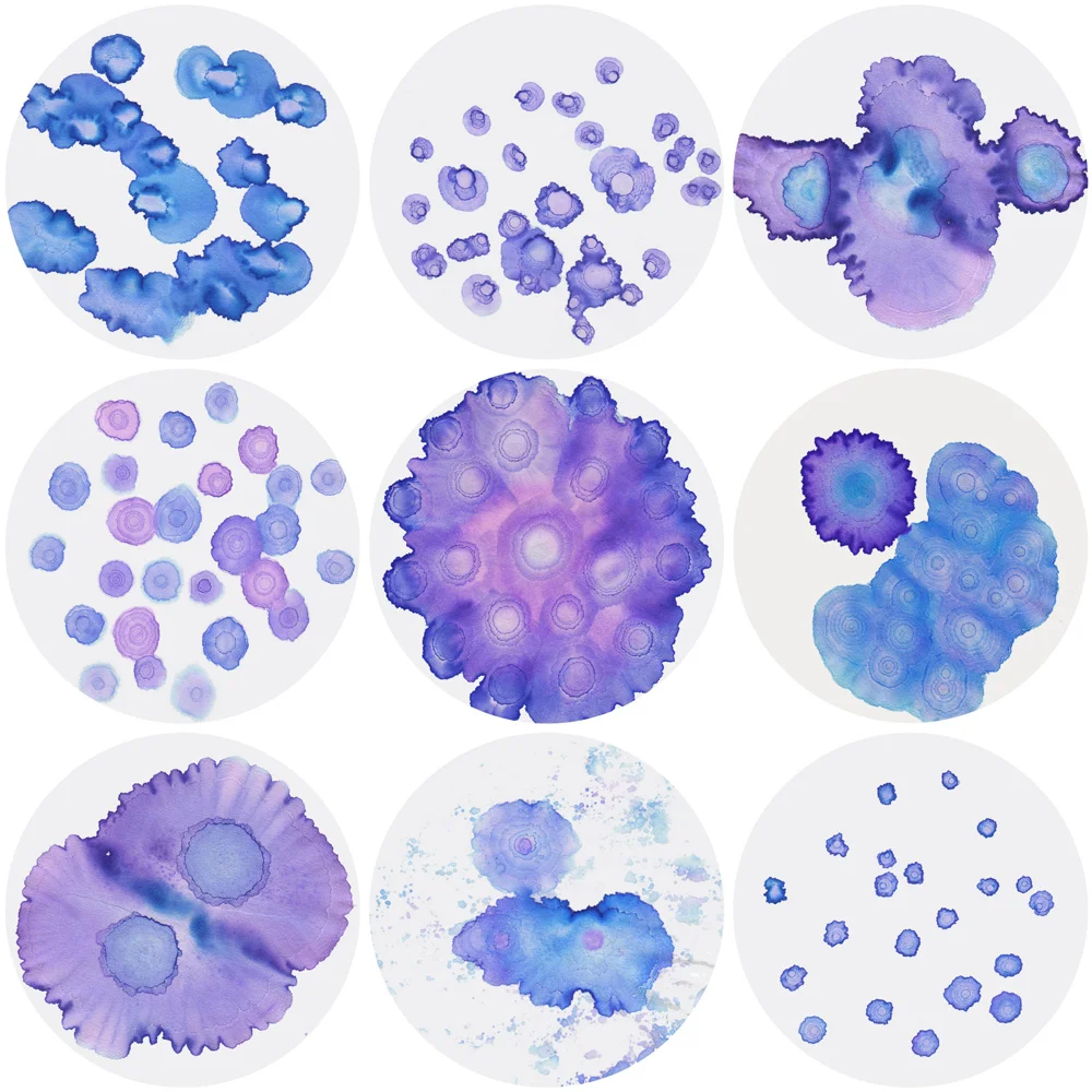 Image description; 9 circular ink patterns made with mixtures of blue and pink ink. 