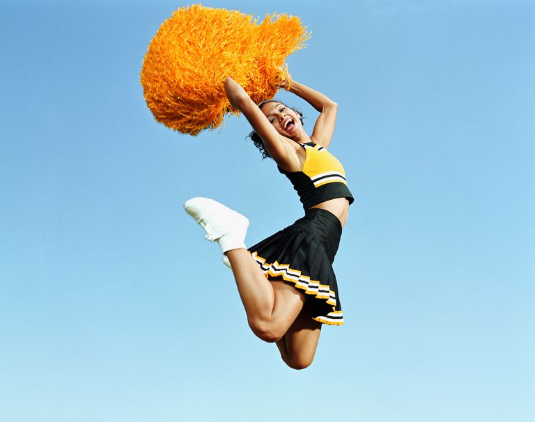 cheerleader-jumping-in-mid-air--holding-pompoms--portrait-200068151-001-59937ff2af5d3a001168f623.jpg