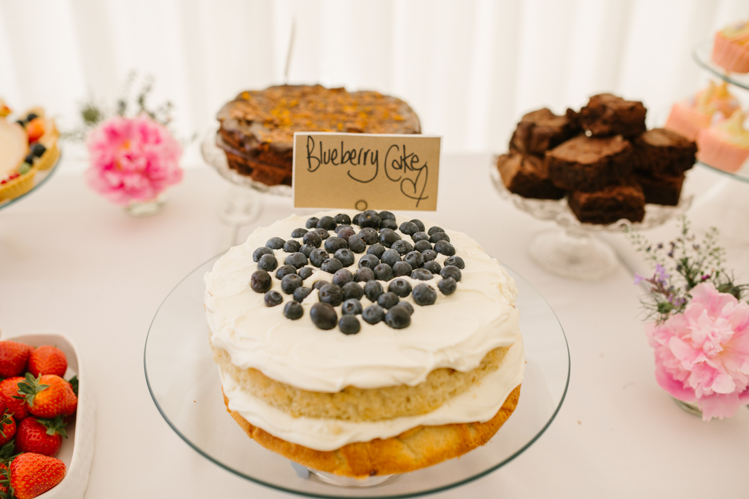 homemade blueberry cake on the dessert table at a wedding in the walled garden beeston fields