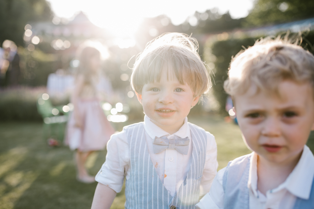 close up photo of children at weddings in the golden hour sunlight