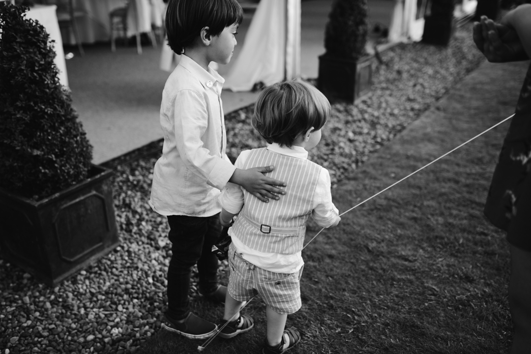 black and white natural photo of children at summer wedding 