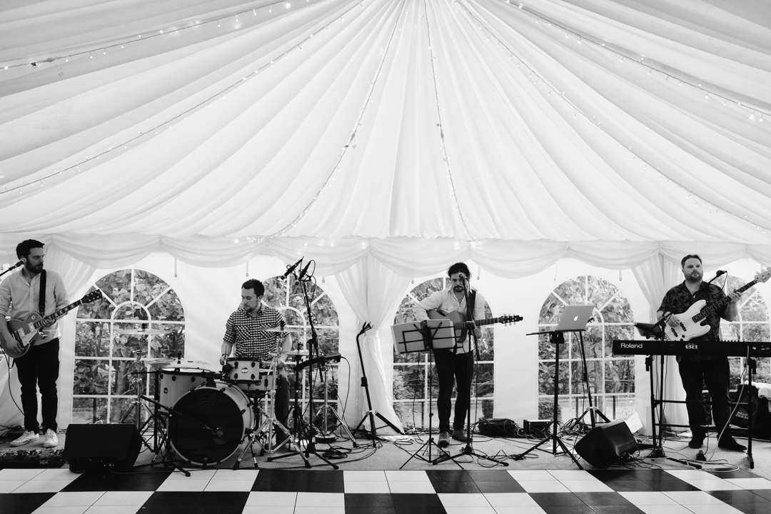black and white photo of wedding band in a marquee at nottingham wedding