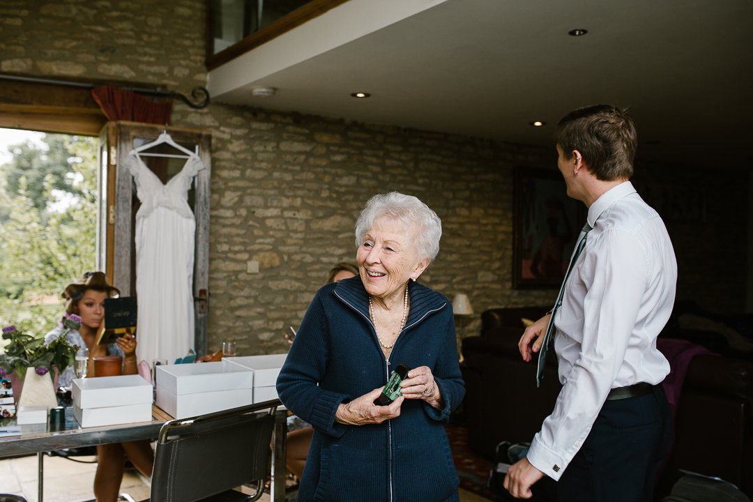 candid photo of nan smiling at her granddaughter on the morning of her wedding day