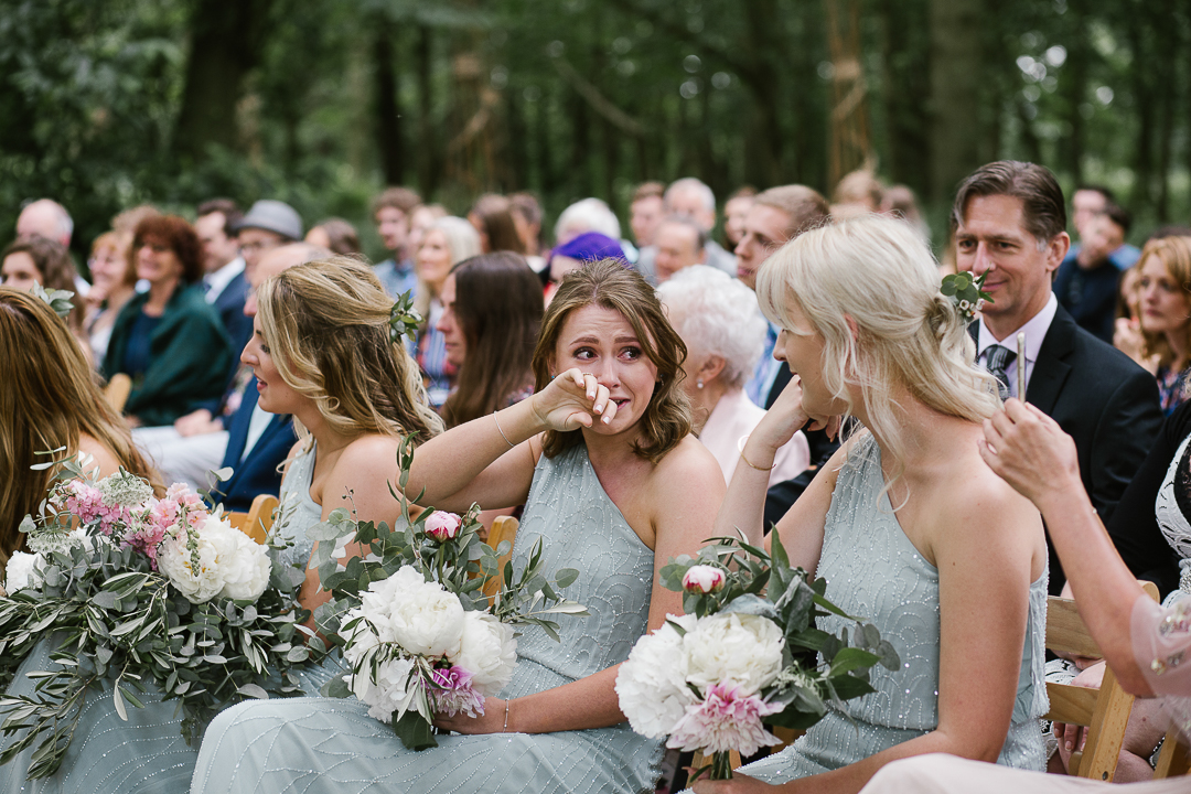 bridesmaid crying during emotional wedding ceremony