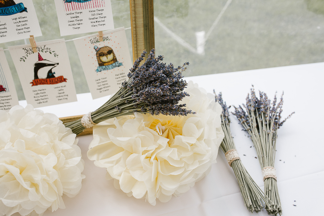 dried lavender and pom pom decorations in a marquee wedding venue