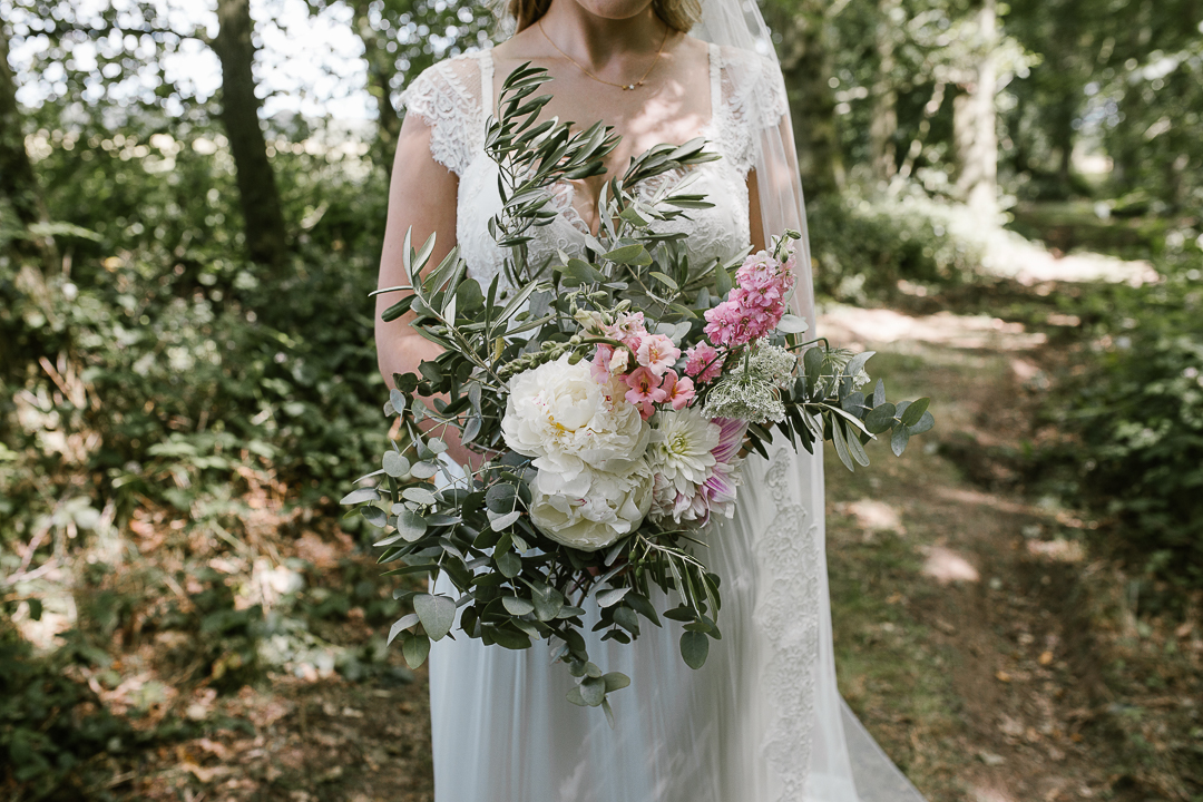 natural photo of wedding bouquet holding wild summer flowers 