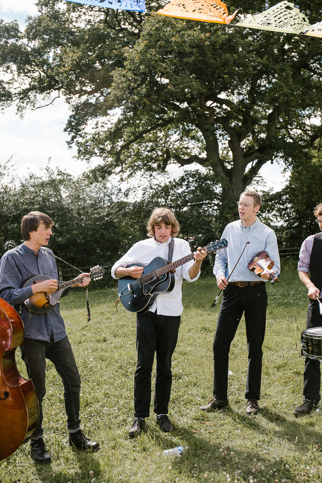 live band playing the guitar at a summer wedding