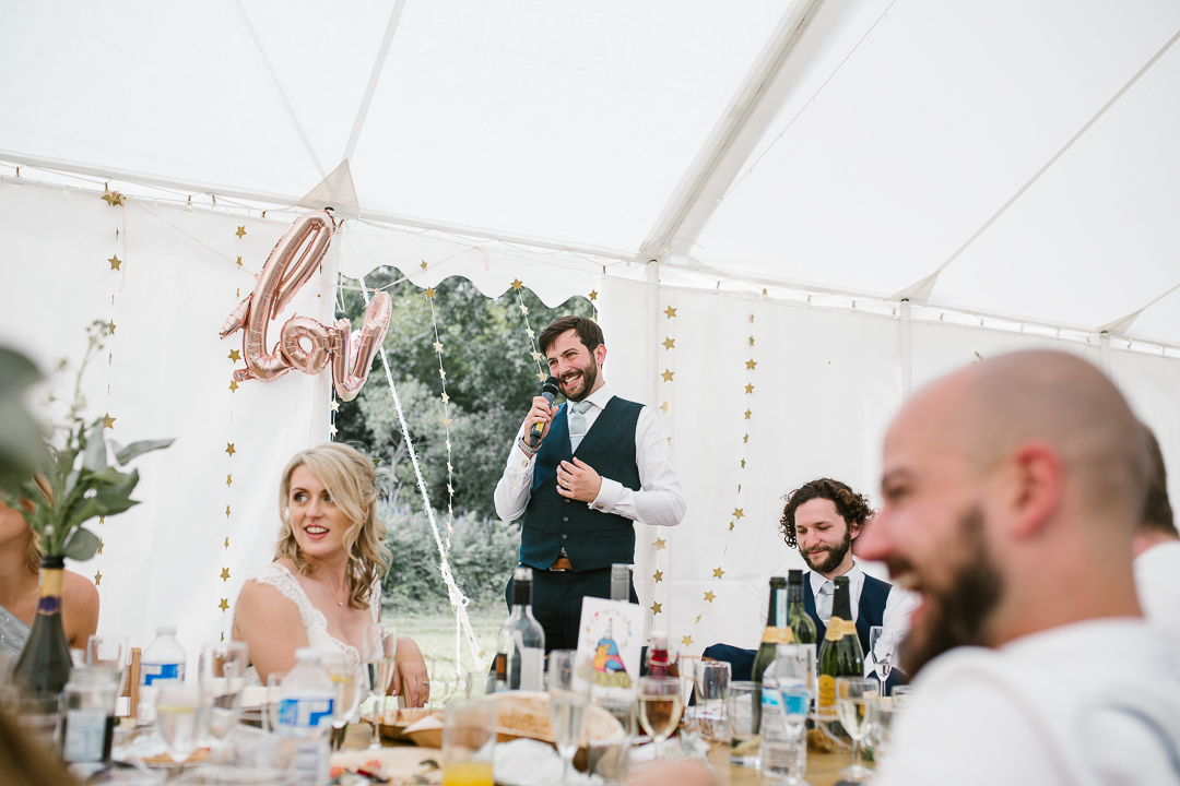 emotional photo of the groom reading his speech