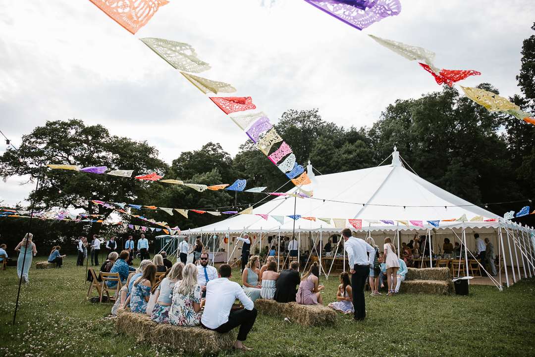 festival themed marquee wedding at wildwood bluebell in the cotswolds