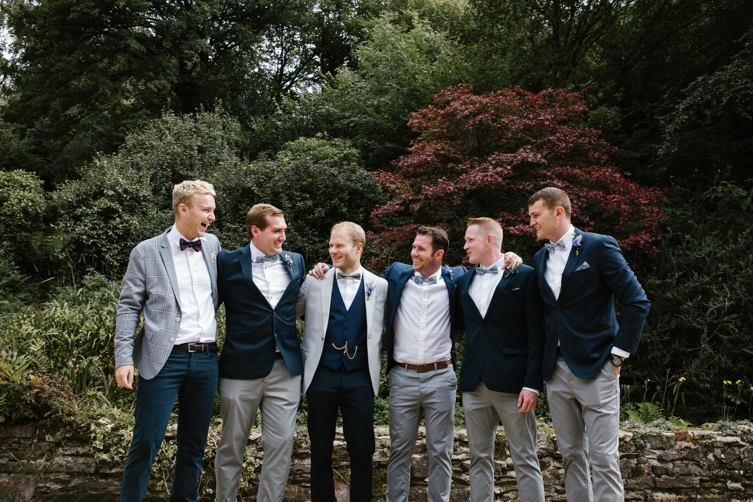 natural photo of groom and groomsmen on the morning of his outdoor tipi wedding 