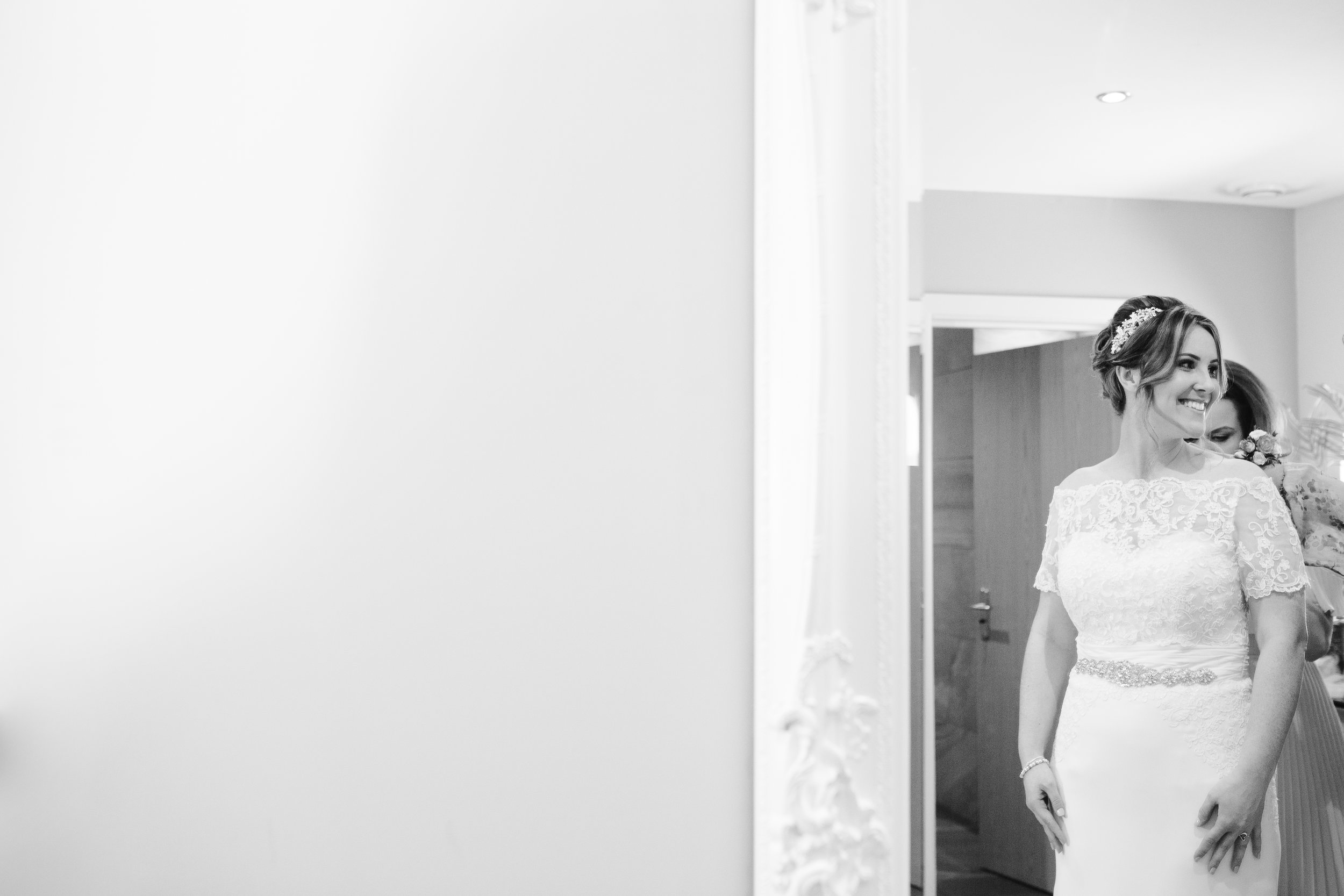black and white photo of bride before she walks down the aisle