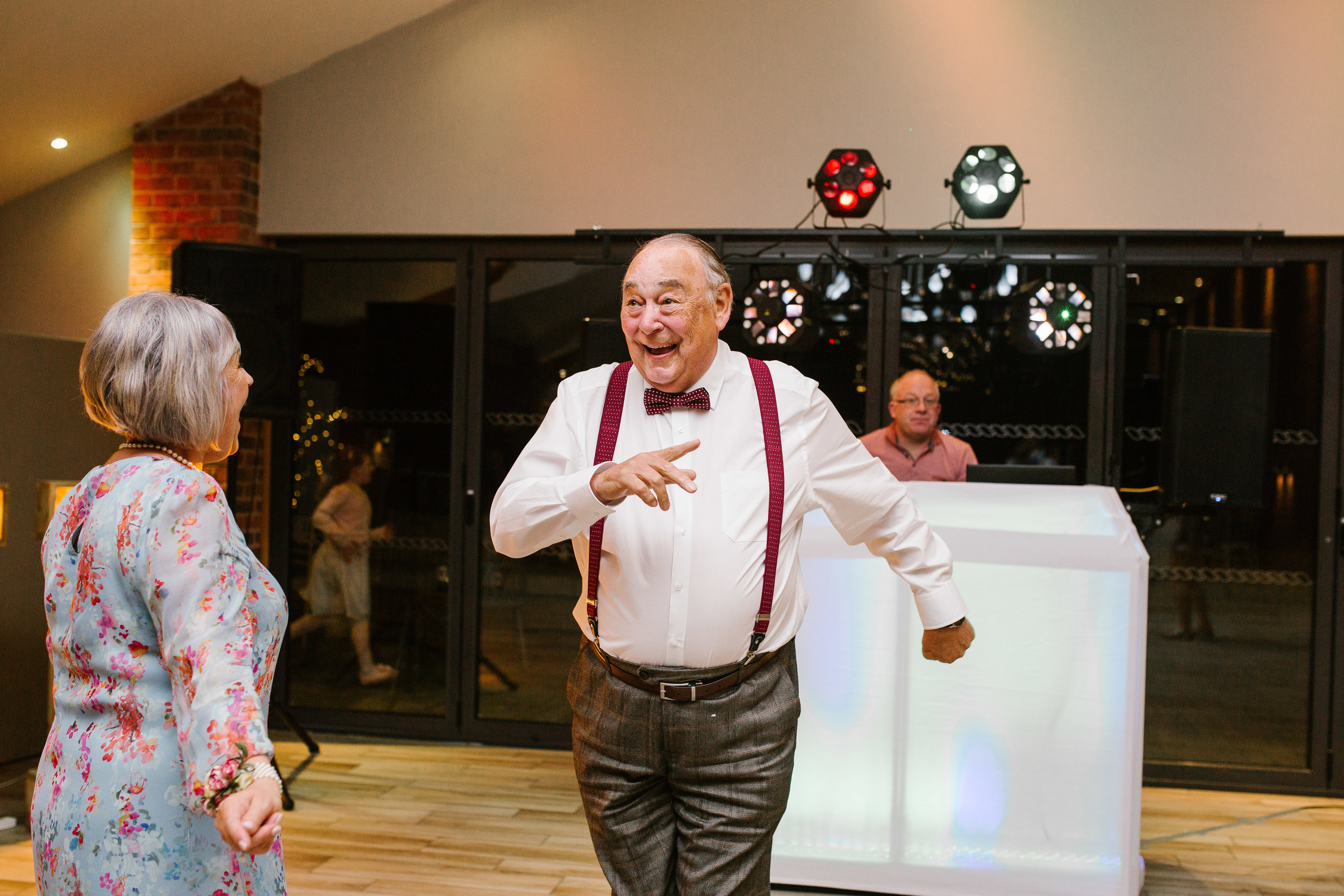 grandad dancing on the dance floor with a huge smile on his face