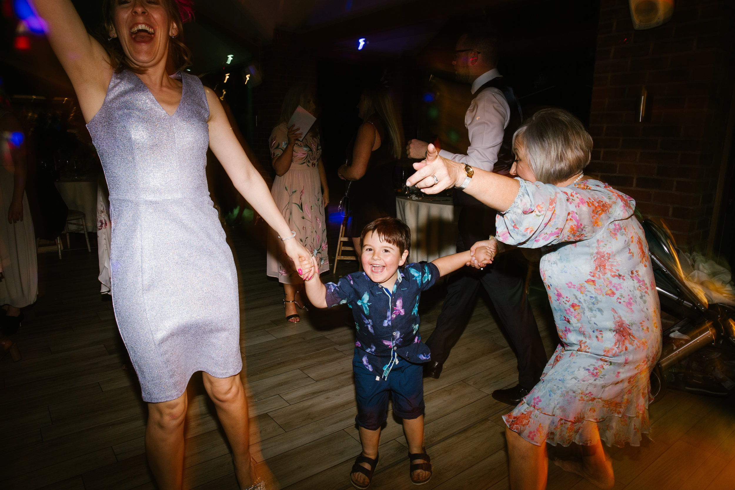 little boy jumping up and down on the dance floor at the party music 