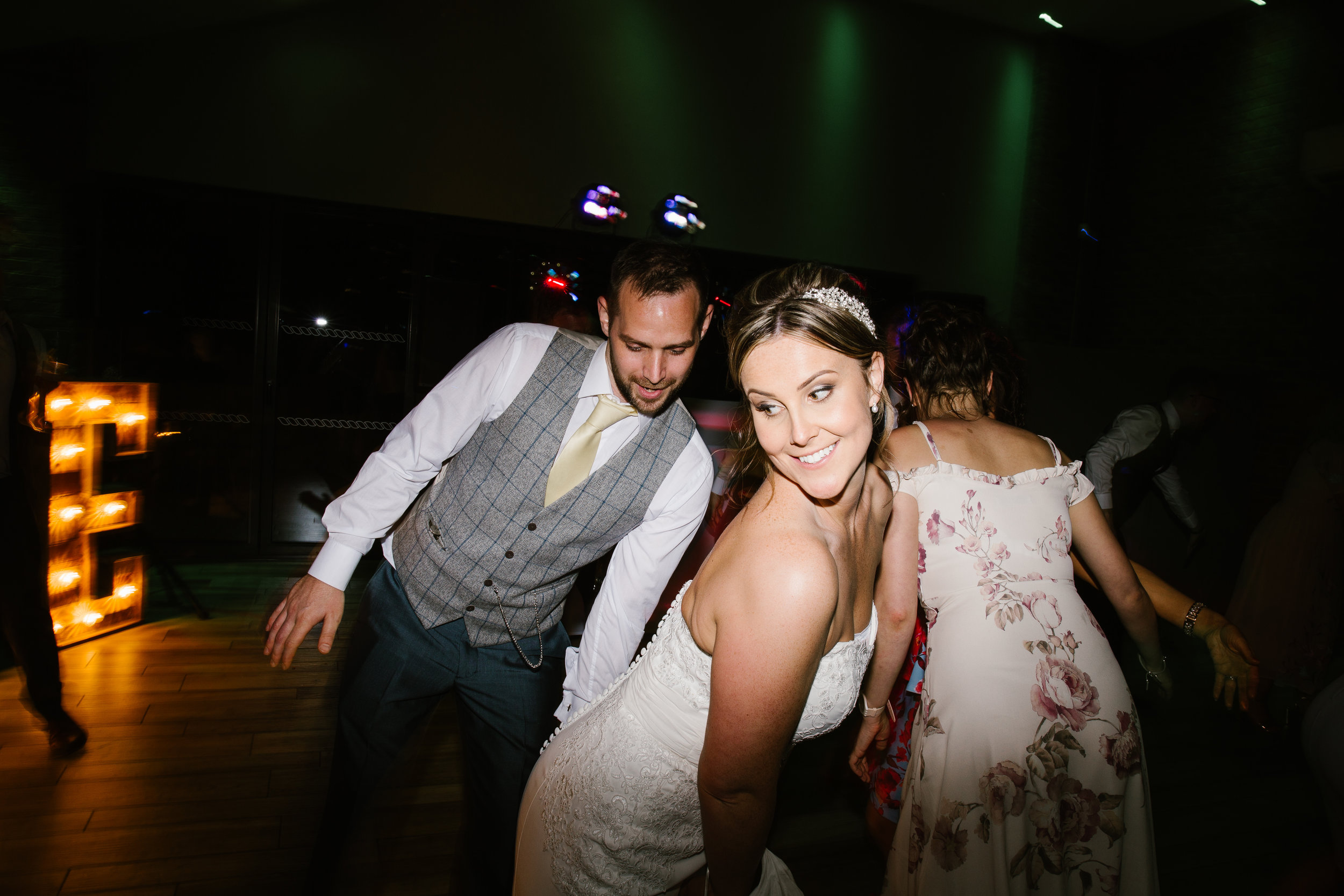 bride and groom being seductive on the dance floor