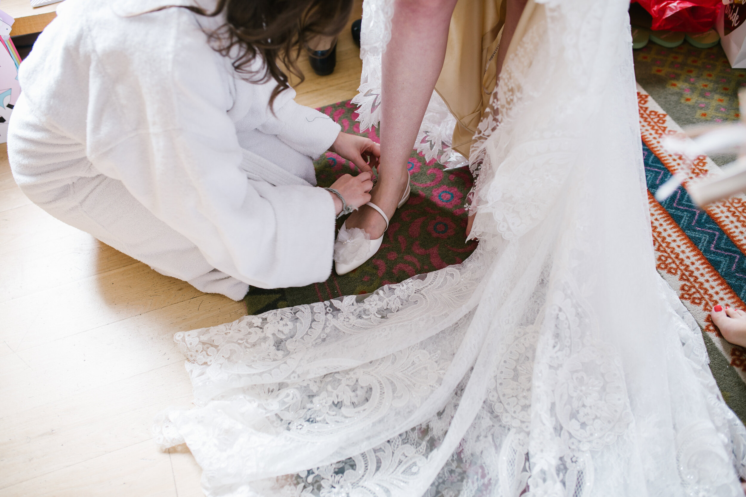 details shot of the bottom of a lace boho bridal gown