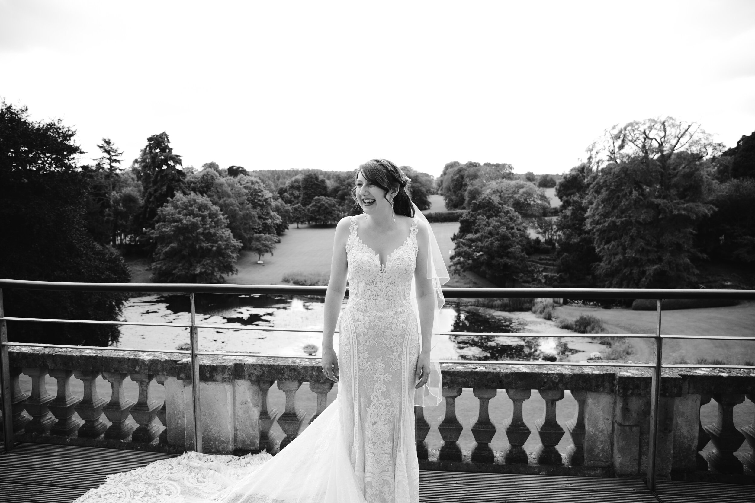 black and white photograph of the bride on the morning of her wedding at cowley manor in the cotswolds