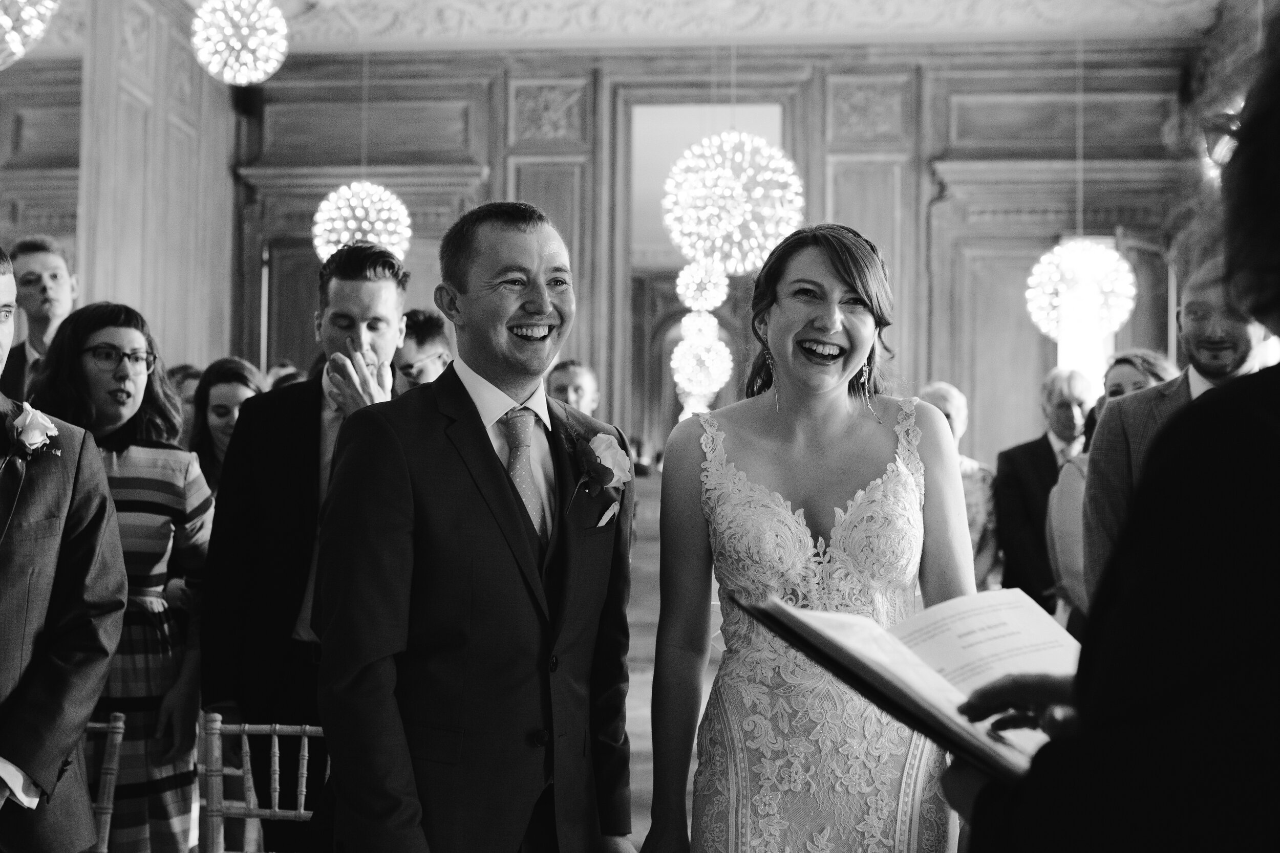 natural photo of bride and groom during their vows at cowley manor