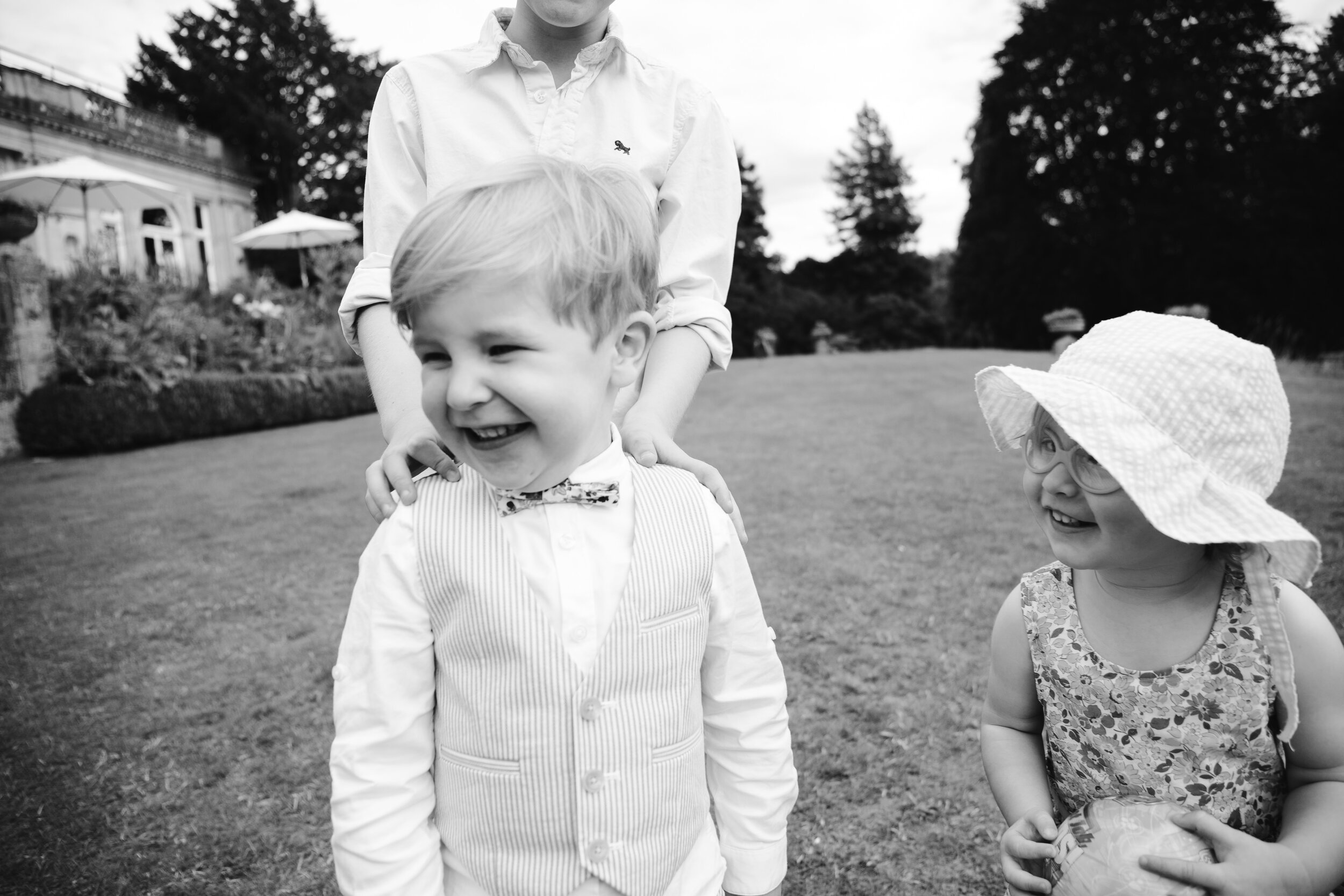 documentary black and white photo of kids at weddings at cowley manor