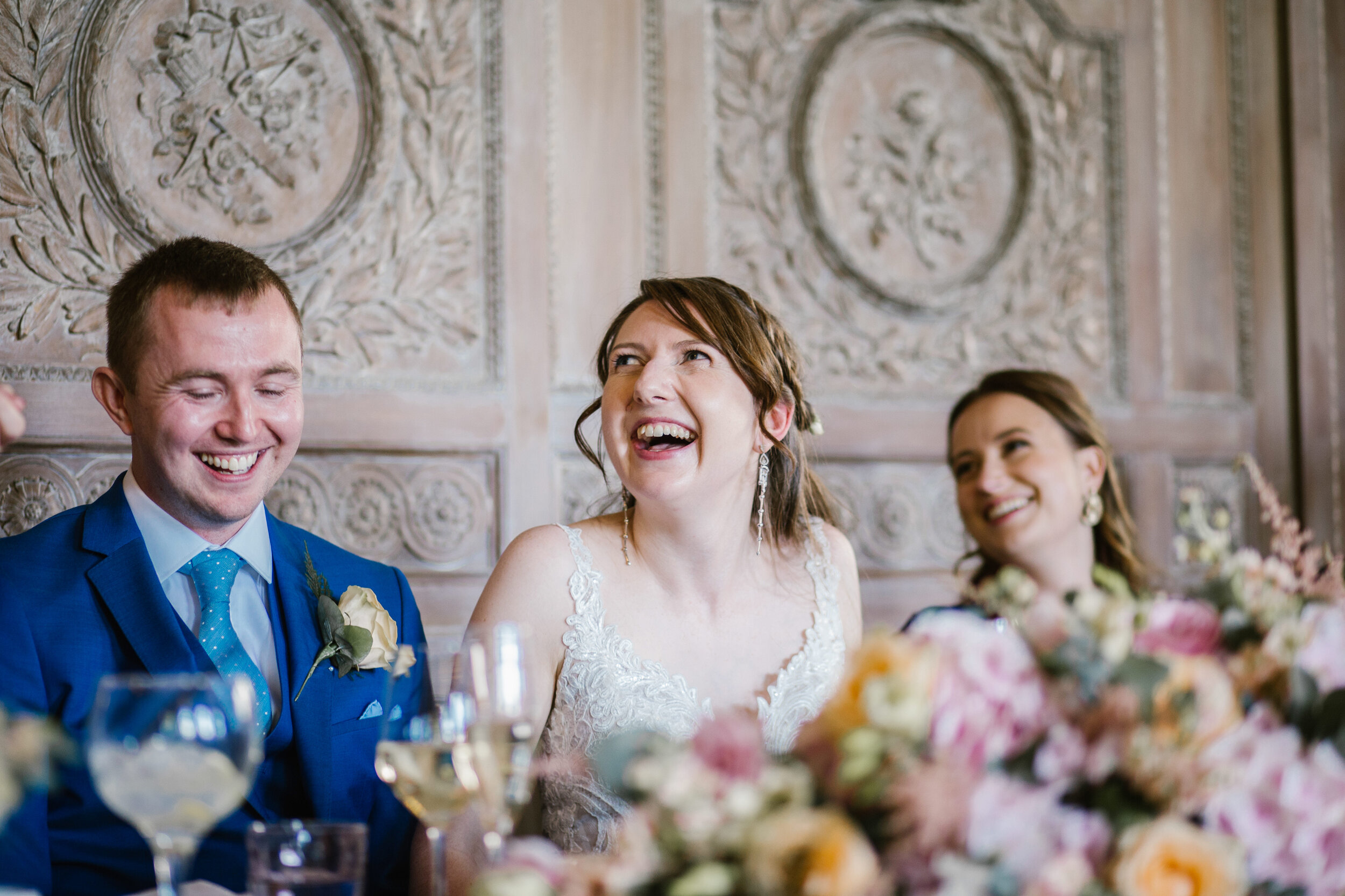 bride laughing during the best man speech at cowley manor