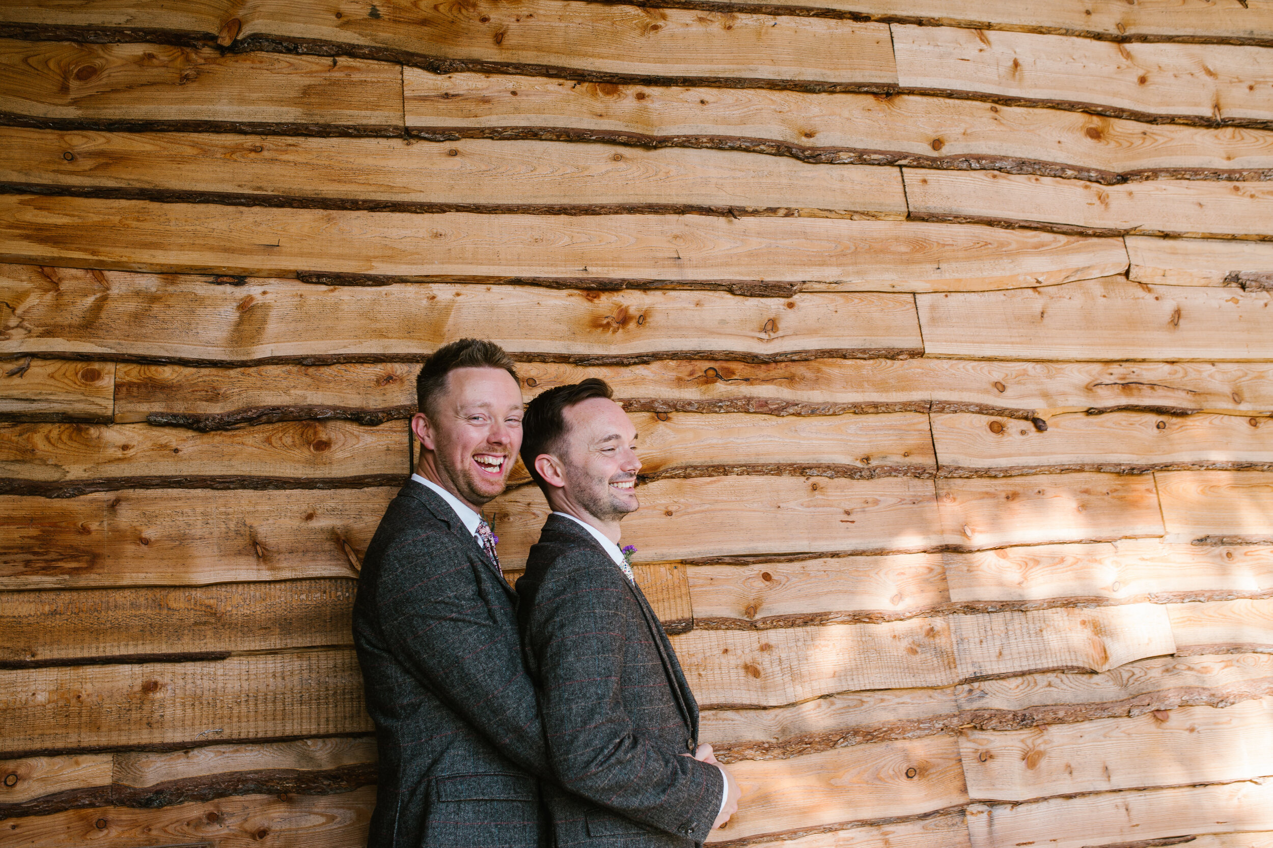 photo of two grooms out side at tower hill barns 