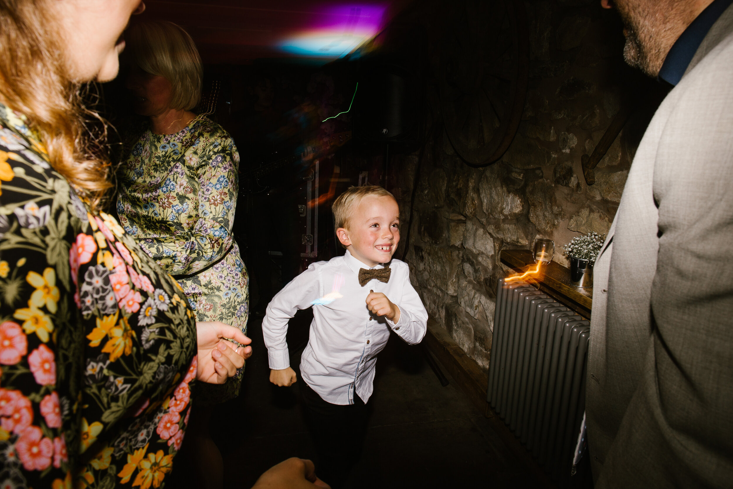 little boy in bowtie dancing on the dance floor at tower hill barns wedding