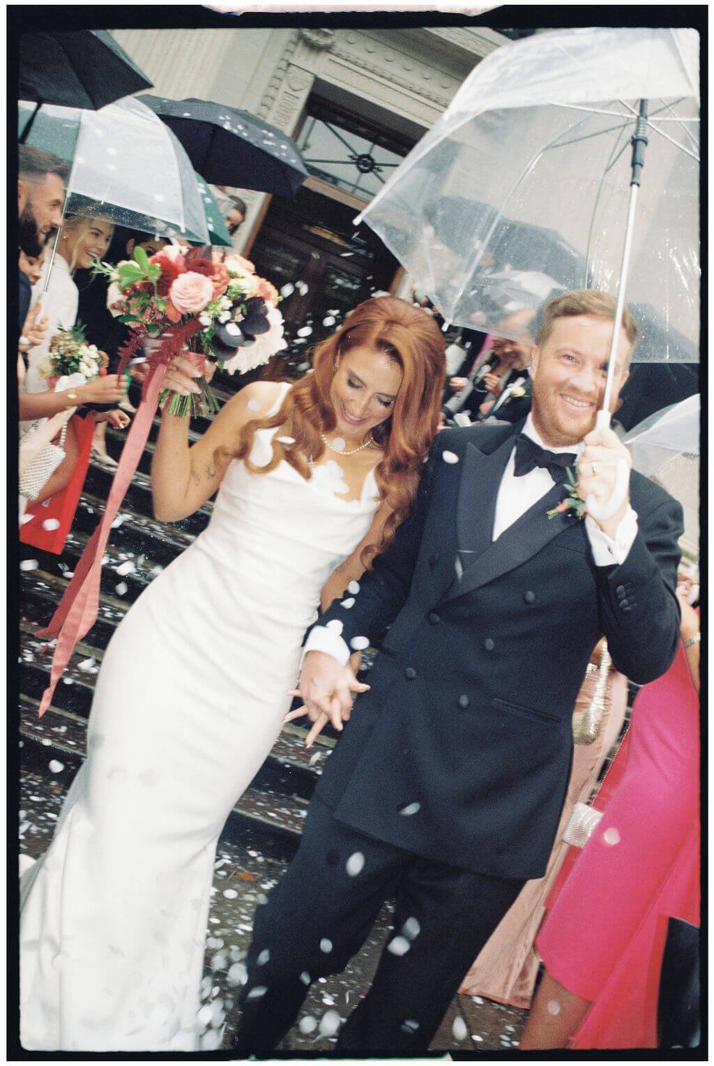 Couple come down the steps at Old Marylebone Town Hall Wedding