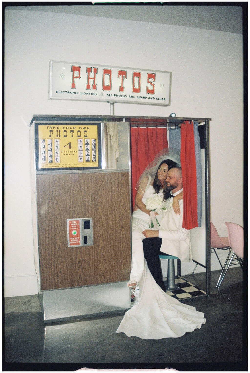 Couple pose in a photobooth at their Las Vegas Elopement